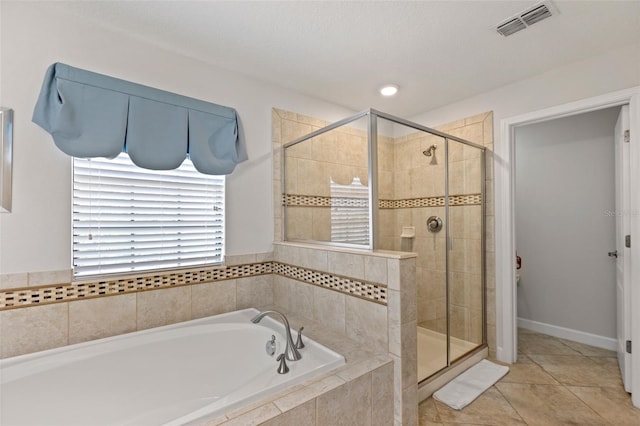 bathroom featuring a garden tub, a shower stall, visible vents, and tile patterned floors