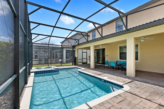 view of pool with ceiling fan, a patio, outdoor dining space, and a lanai