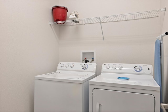 washroom with laundry area and washer and clothes dryer