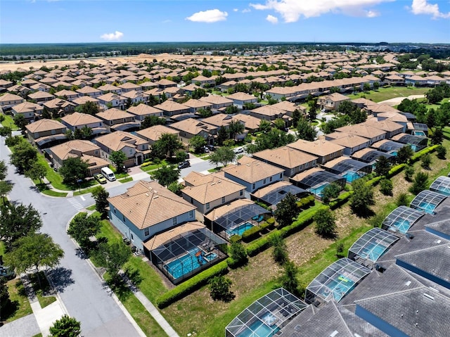 birds eye view of property with a residential view