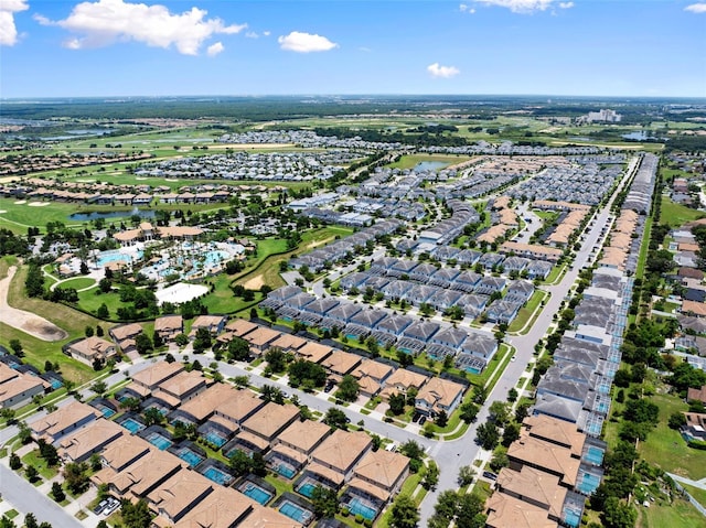 drone / aerial view with a residential view and a water view