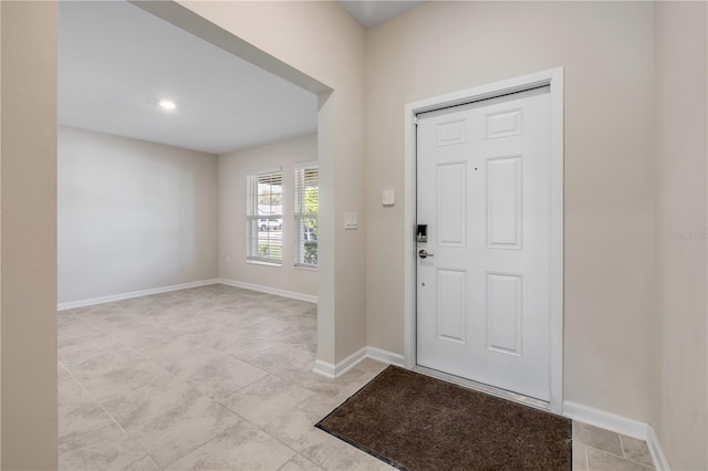 entrance foyer featuring baseboards