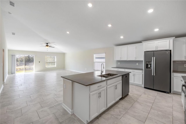 kitchen with visible vents, dark countertops, dishwashing machine, stainless steel refrigerator with ice dispenser, and a sink