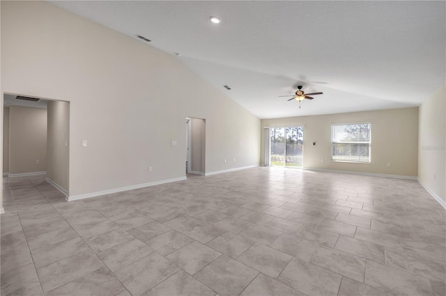 empty room featuring a ceiling fan, visible vents, and baseboards