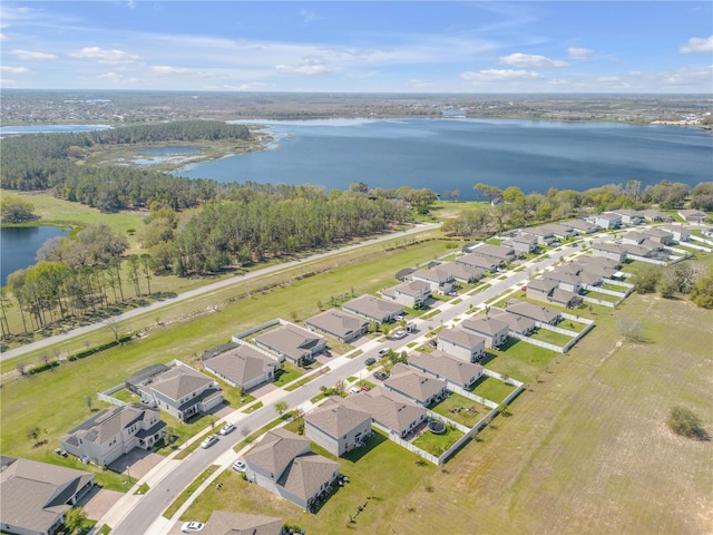 bird's eye view featuring a residential view and a water view