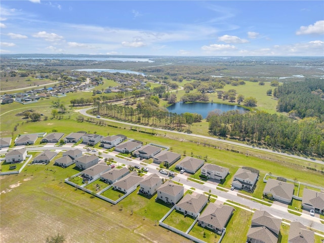 bird's eye view featuring a water view and a residential view