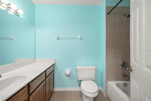 full bath featuring baseboards, toilet, vanity, tile patterned floors, and shower / bathtub combination