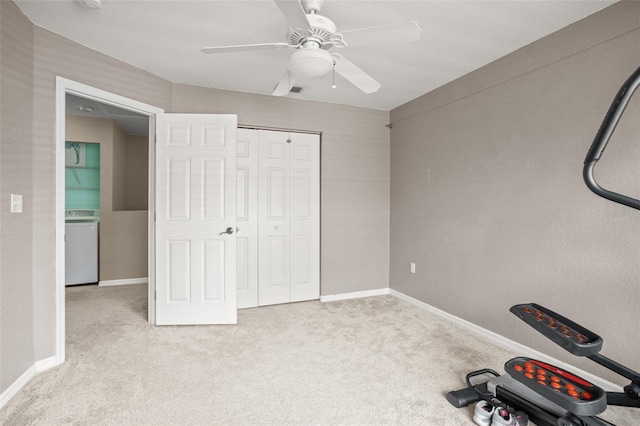 exercise area with carpet, baseboards, washer / clothes dryer, and a ceiling fan