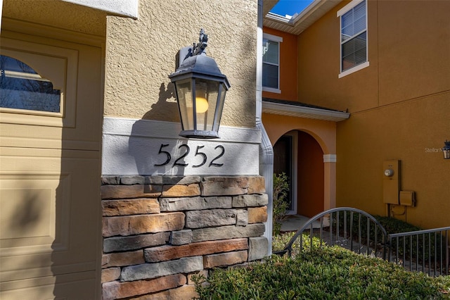 exterior details featuring stucco siding