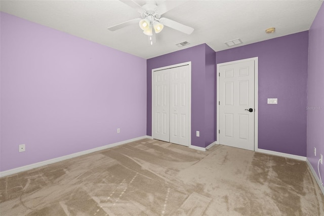 unfurnished bedroom featuring baseboards, visible vents, and a closet