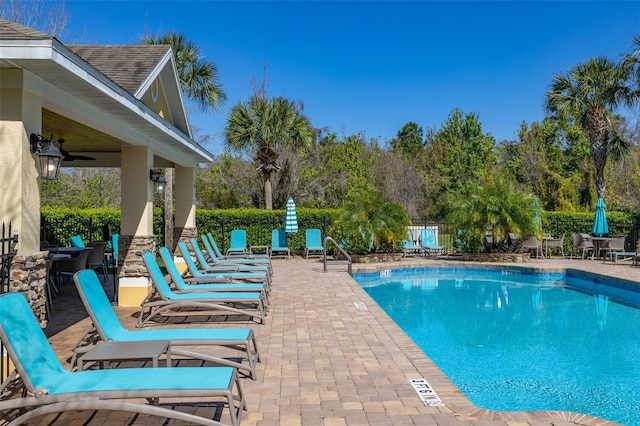 pool featuring a patio and fence