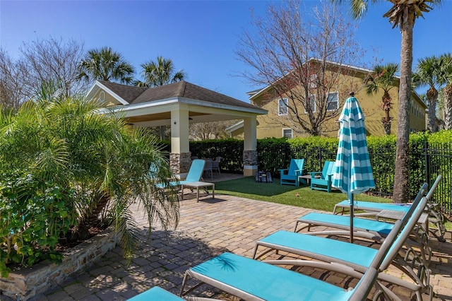 view of patio / terrace with fence and a gazebo