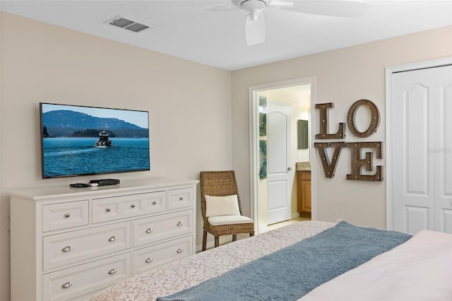 bedroom with ensuite bath, visible vents, and a ceiling fan