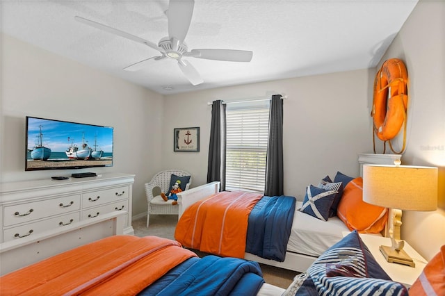 bedroom with carpet floors, ceiling fan, and baseboards