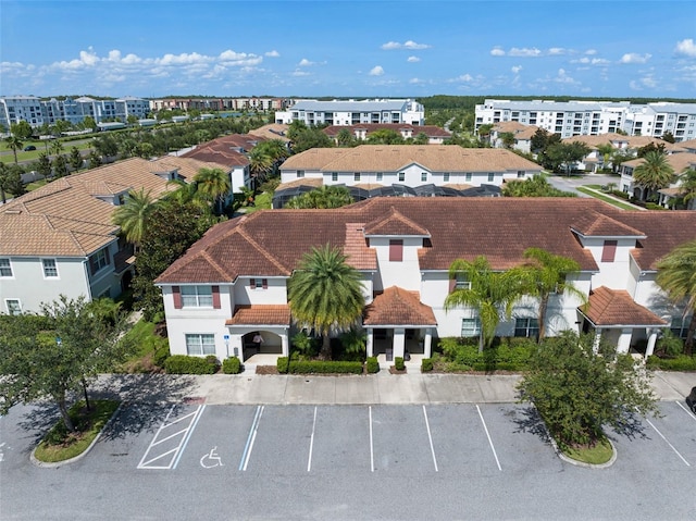 birds eye view of property with a residential view