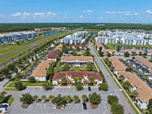 drone / aerial view with a water view