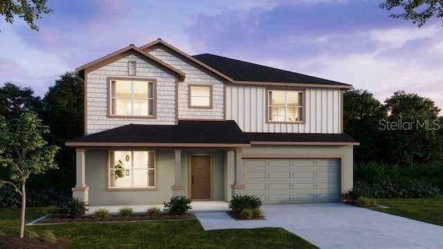 view of front of property featuring concrete driveway, board and batten siding, and an attached garage