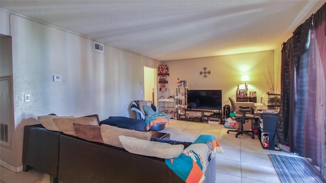 living area with light tile patterned floors, visible vents, a textured ceiling, and crown molding