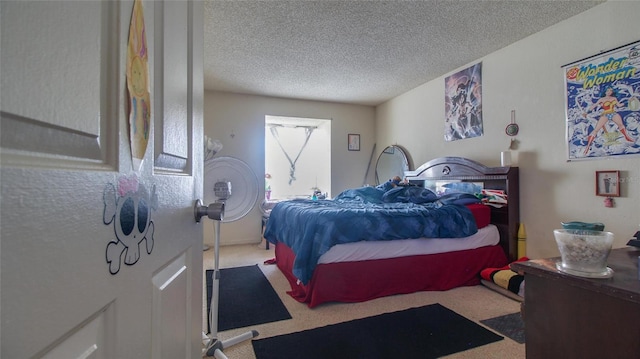 carpeted bedroom with a textured ceiling