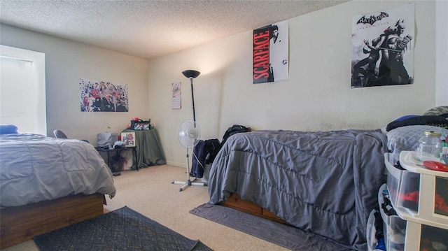 carpeted bedroom featuring a textured ceiling