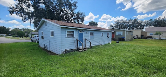 back of house featuring a yard