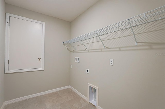 clothes washing area with laundry area, hookup for a washing machine, electric dryer hookup, and baseboards