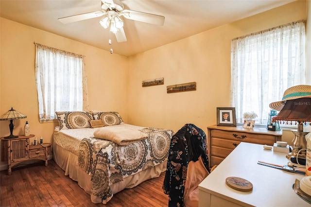 bedroom featuring dark wood-style floors and ceiling fan