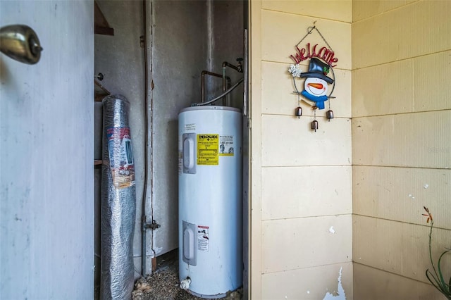 utility room featuring water heater