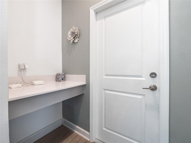 9747 Petition Way, Orlando, FL 32832 - bathroom featuring baseboards and wood finished floors