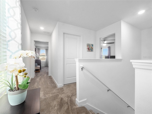 9747 Petition Way, Orlando, FL 32832 - corridor featuring baseboards, recessed lighting, an upstairs landing, carpet floors, and visible vents