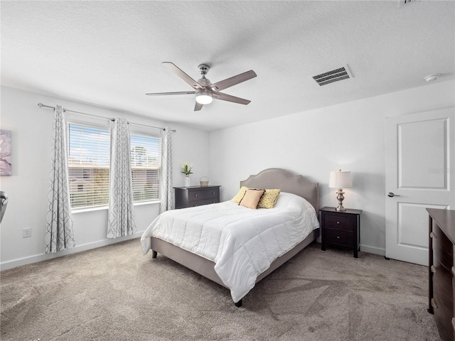 9747 Petition Way, Orlando, FL 32832 - carpeted bedroom featuring visible vents, baseboards, and a textured ceiling