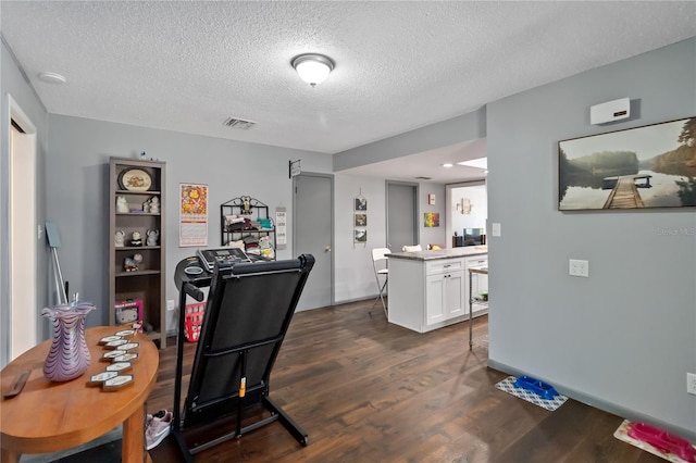 1489 Magellan Cir Unit 603, Orlando, FL 32818 - dining space featuring dark wood-style floors, a textured ceiling, and visible vents