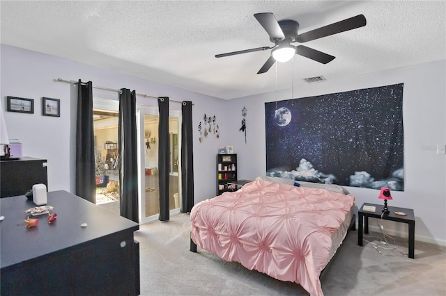 1489 Magellan Cir Unit 603, Orlando, FL 32818 - bedroom featuring a textured ceiling, baseboards, light colored carpet, visible vents, and ceiling fan