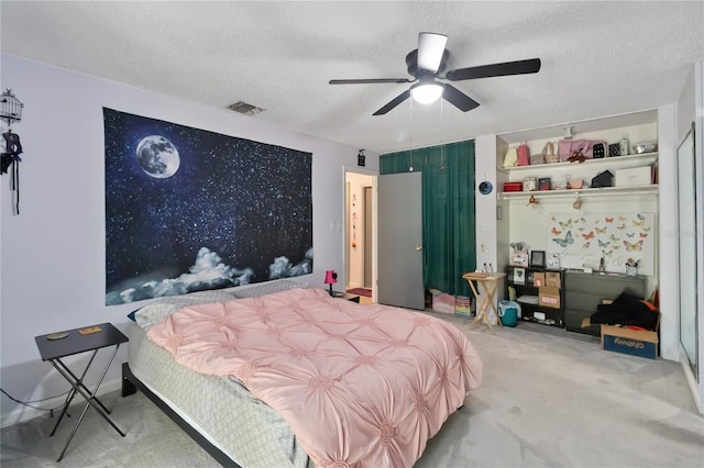 1489 Magellan Cir Unit 603, Orlando, FL 32818 - carpeted bedroom with a textured ceiling, visible vents, and ceiling fan
