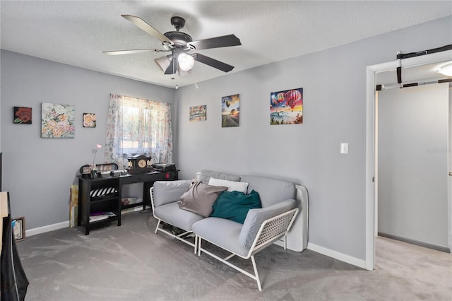 1489 Magellan Cir Unit 603, Orlando, FL 32818 - living area featuring carpet floors, ceiling fan, and a textured ceiling