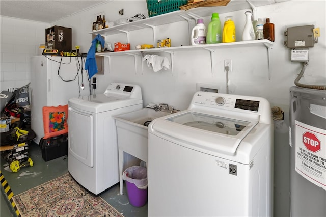 1489 Magellan Cir Unit 603, Orlando, FL 32818 - clothes washing area with electric water heater, washer and dryer, and laundry area