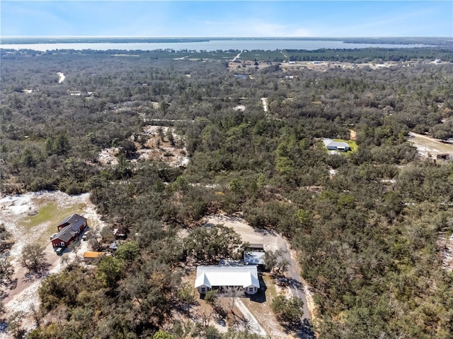 bird's eye view featuring a water view and a view of trees