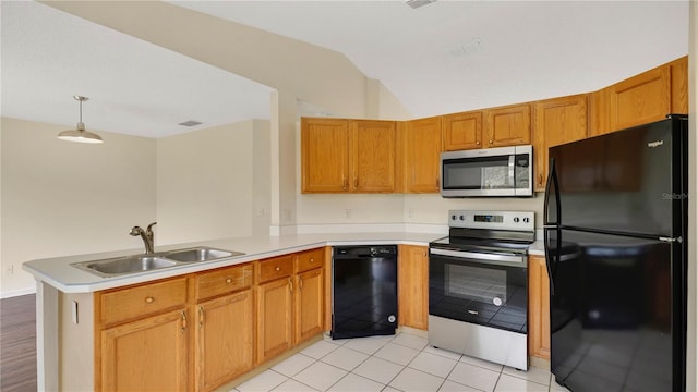 kitchen with a peninsula, vaulted ceiling, light countertops, black appliances, and a sink