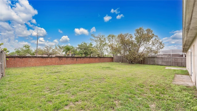 view of yard featuring a fenced backyard