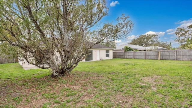 view of yard with a fenced backyard