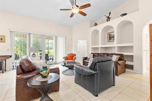 living room featuring built in features, a ceiling fan, high vaulted ceiling, and light tile patterned floors