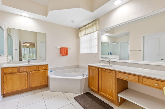 bathroom with two vanities, tile patterned flooring, a sink, and a shower stall