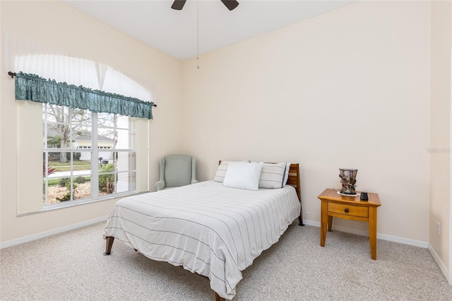 carpeted bedroom featuring ceiling fan and baseboards