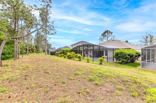 view of yard with a lanai