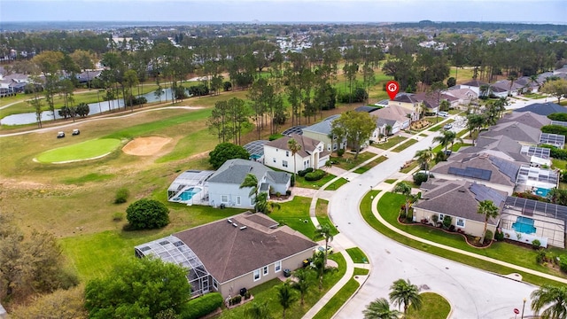 drone / aerial view with a residential view and golf course view