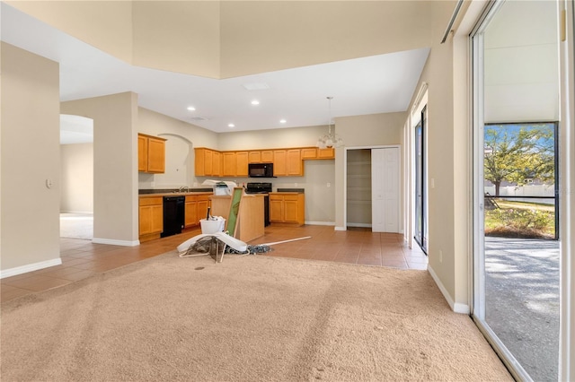 workout area featuring light tile patterned floors, recessed lighting, a high ceiling, light carpet, and baseboards