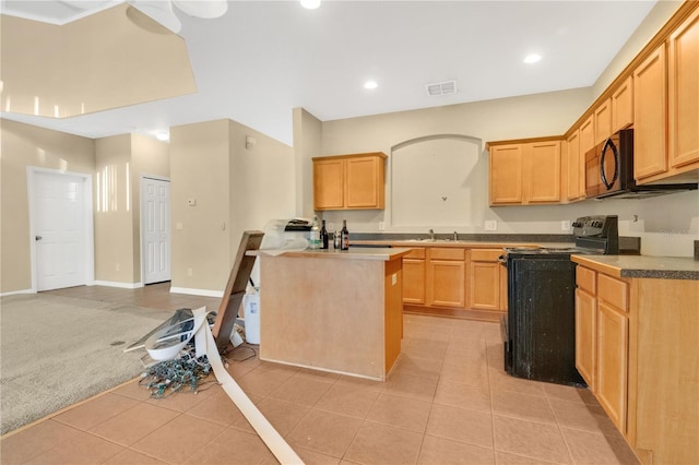 kitchen with light carpet, black appliances, light tile patterned flooring, and light brown cabinets