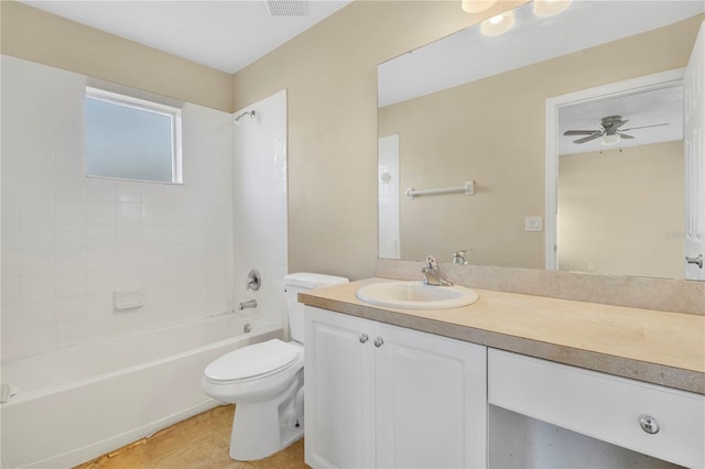 bathroom featuring shower / bath combination, a ceiling fan, toilet, tile patterned flooring, and vanity