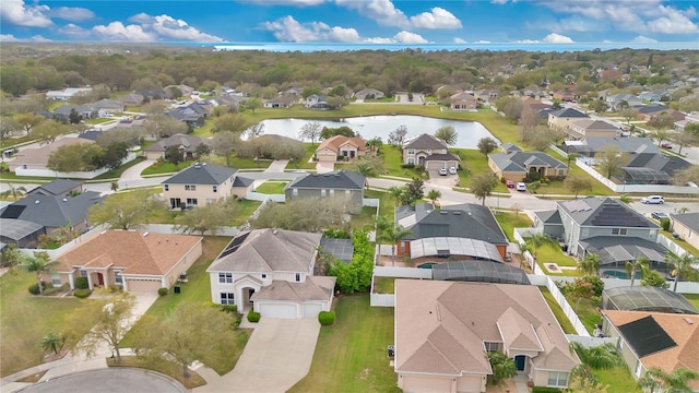 bird's eye view featuring a water view and a residential view