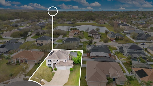 bird's eye view featuring a water view and a residential view